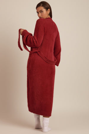 Oh Polly's Hayley wearing the Priya Cardigan in Ruby Red fabric perfect for holiday parties