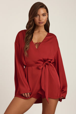 Oh Polly's Hayley wearing the Reina Cardigan in Ruby Red Satin fabric perfect for date night