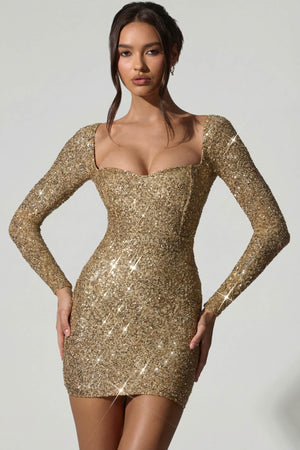 Oh Polly's Anna wearing the Sephina Mini Dress in Gold Micro Sequin fabric perfect for clubbing nights