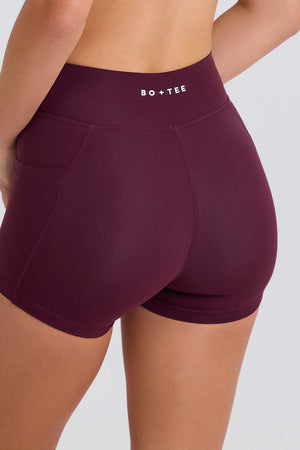 Soft Active V-Waist Pocket Mini Shorts in Burgundy