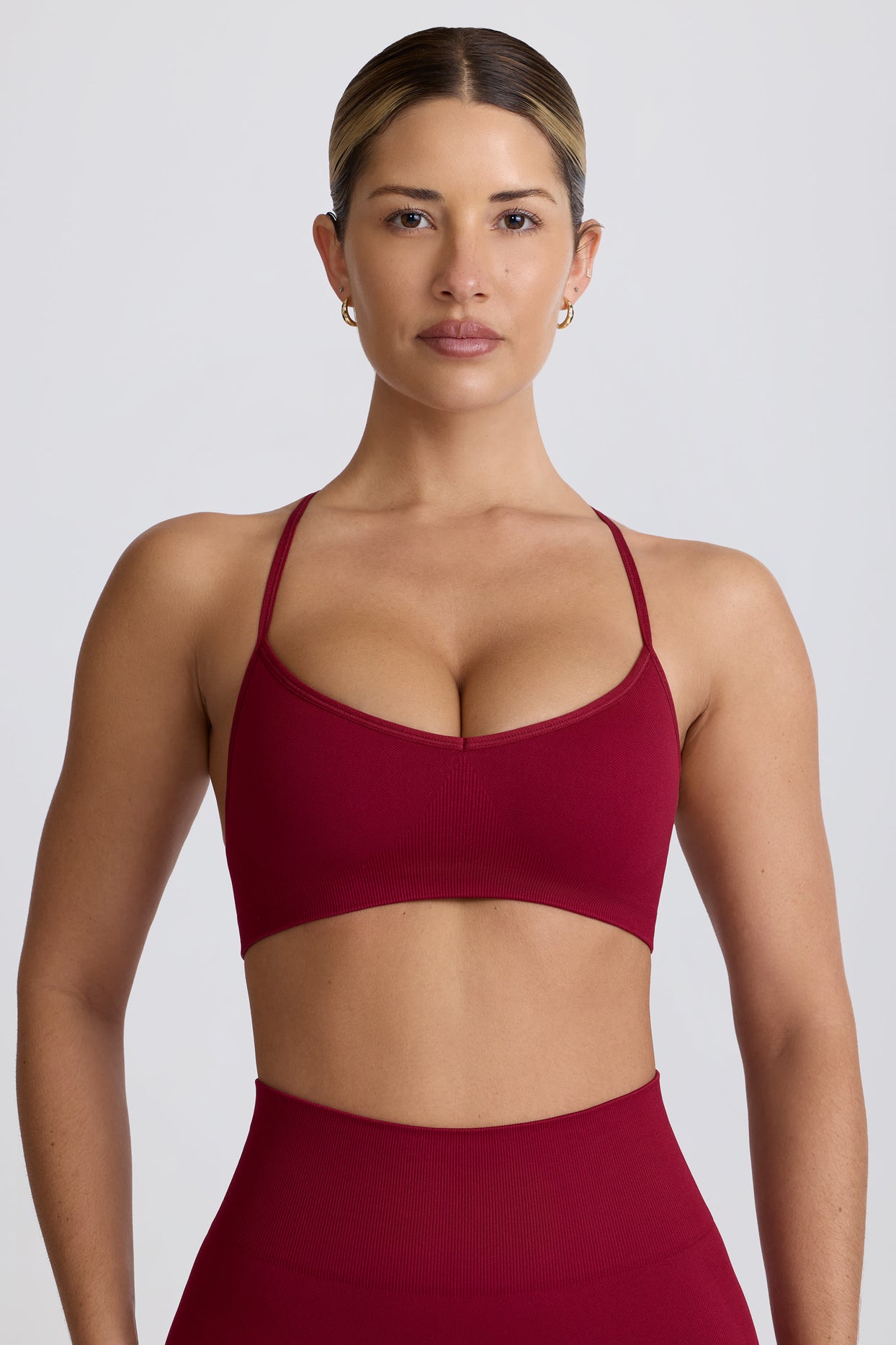 Super Sculpt Seamless Cross-Back Sports Bra in Burgundy - 1