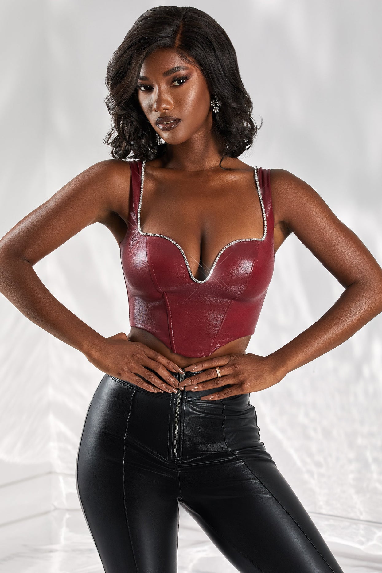 https://au.ohpolly.com/cdn/shop/products/4974_7_day-dream-burgundy-embellished-plunge-faux-leather-crop-top_1.jpg?v=1689167642&width=1244