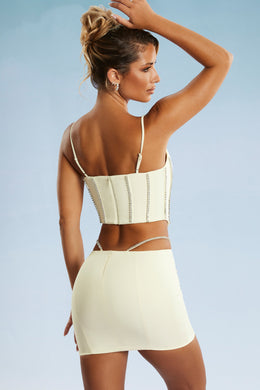 Back view of Embellished Cut Out Mini Skirt in Ivory