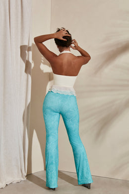 Back view of pull on design - Flare tall trousers in teal print.