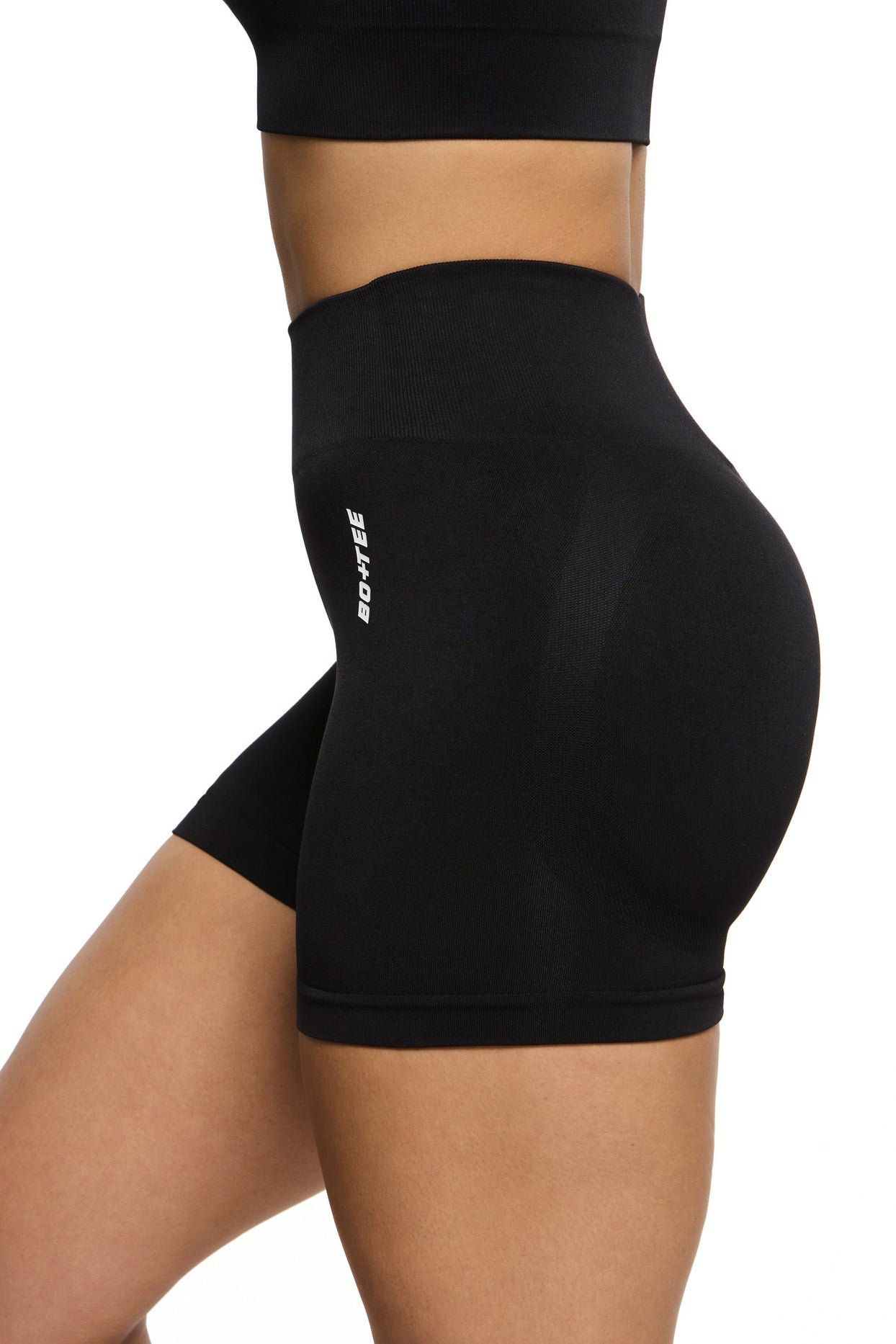 Side view of Seamless High Waist Mini Shorts in Black