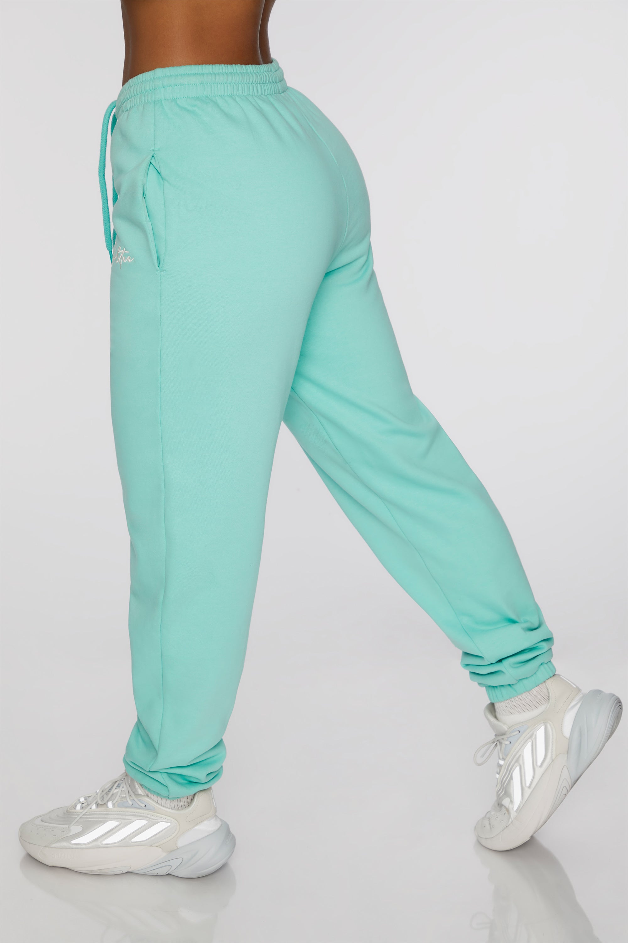 Always Improving Branded Sweatpants in Turquoise Oh Polly